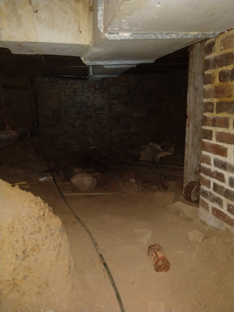 Looking inside the hole in basement wall Chuck's Paranormal Adventures Investigation of the Sallie House -