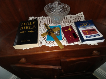 Religious items on cabinet.  Chuck's Paranormal Adventures Investigation of the Sallie House -