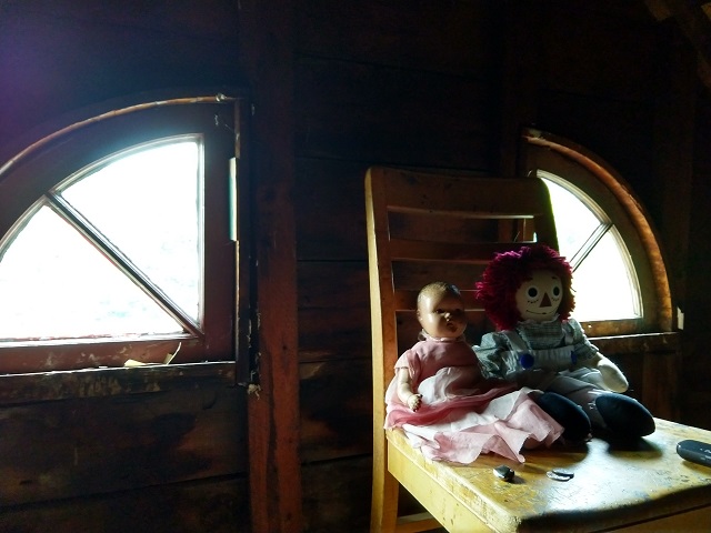 Annabell doll in the attic by the windows that have that Amityville look. Chuck's Paranormal Adventures Investigation of the Villisca Ax Murder House -