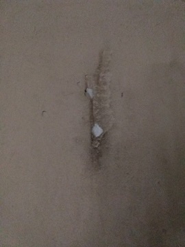 Ax blade gouge in the wall from where the murderer swung his ax. Chuck's Paranormal Adventures Investigation of the Villisca Ax Murder House -