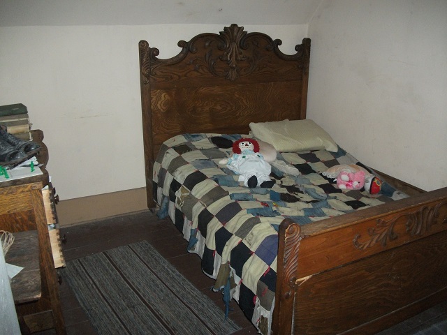  Picture showing the bed the Moore parents slept in, mere feet away from the attic.  Chuck's Paranormal Adventures Investigation of the Villisca Ax Murder House - 